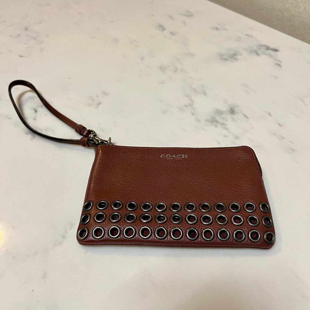 Coach corner zip leather wristlet brown color metal rings detail